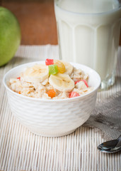 Oatmeal with candied fruils and milk