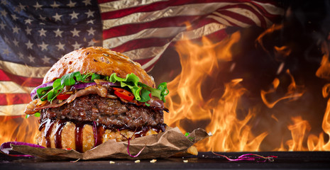 Delicious hamburger with fire flames