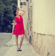 Beautiful brunette girl with red outfit