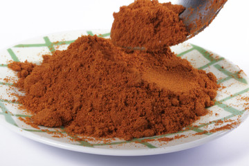 Taking a tablespoon of paprika