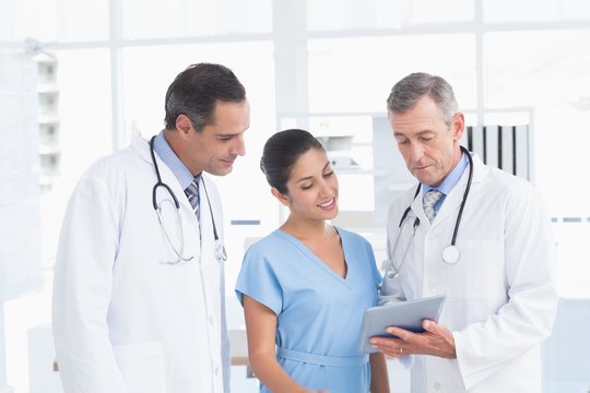 Doctors speaking with nurse 