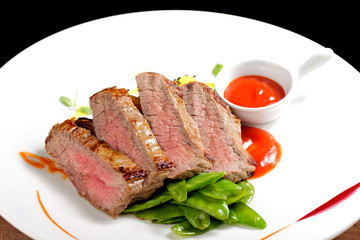 Roasted Kobe Marbled beef fillets with snow peas and tomato sauce