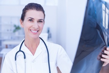 Smiling female doctor looking at camera 