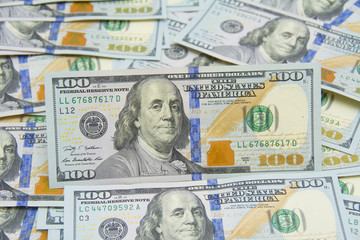 Obraz na płótnie Canvas Background with money american hundred dollar bills - horizontal
