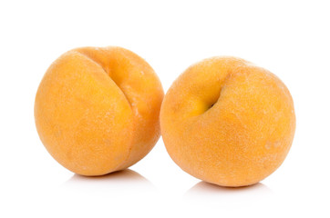 Fototapeta na wymiar ripe yellow peach on white background