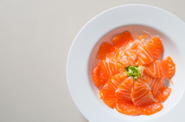 fresh sashimi saimon on white dish background