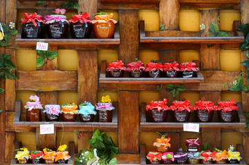 Colorful jam jars arranged for sale