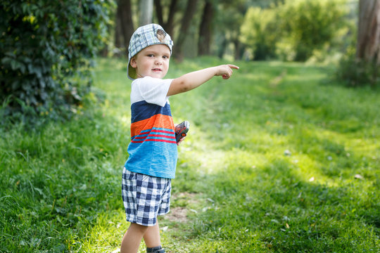 Adorable Little Boy Pointing At Something