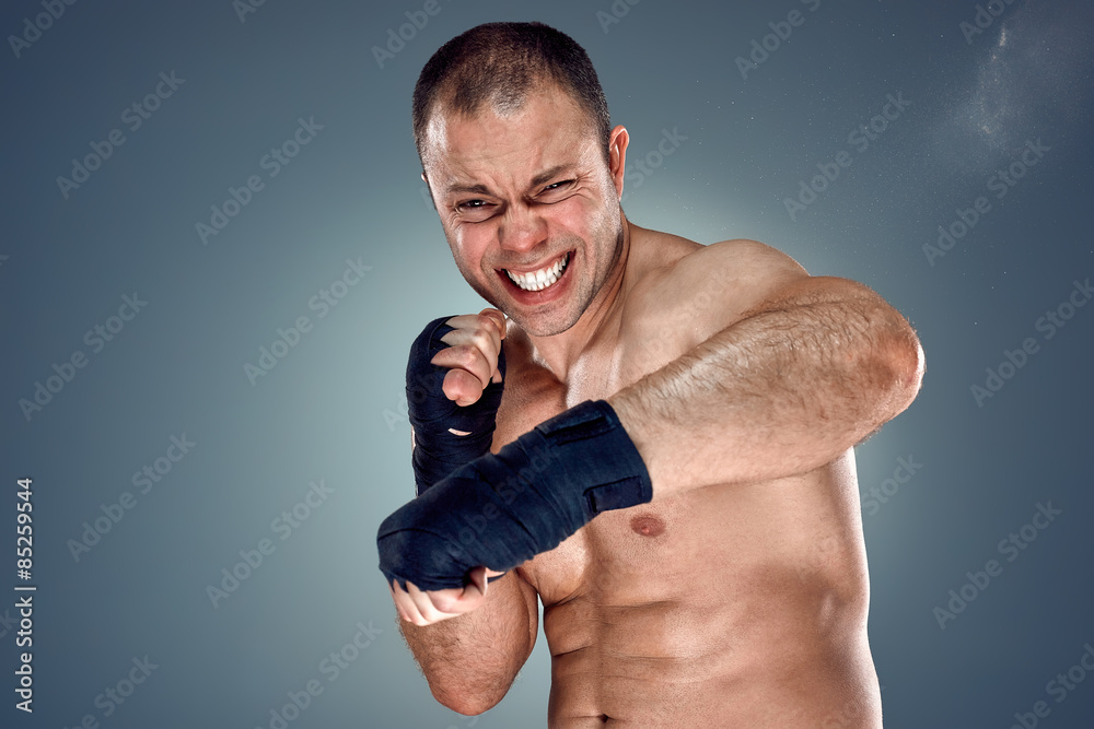 Wall mural Young Boxer boxing 