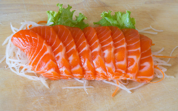 fresh sashimi saimon on wood background