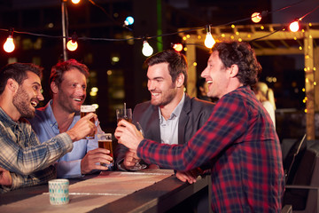 Group of friends at rooftop party