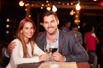 Couple at rooftop party