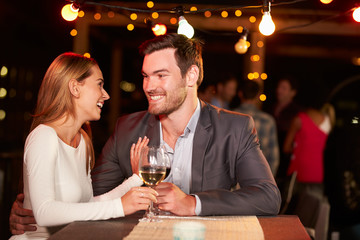 Couple at rooftop party