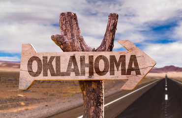 Oklahoma wooden sign with desert road background