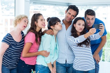 Creative business team taking a selfie