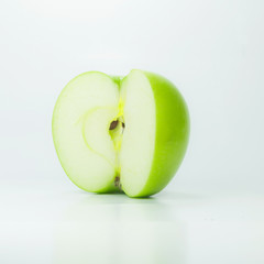 Green apple half on white background