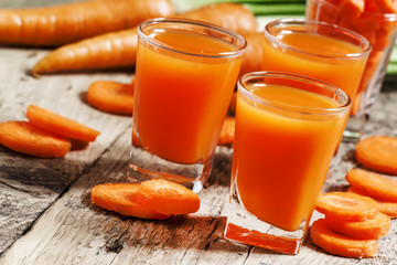 Fresh carrot juice in the glass, selective focus