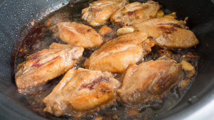 Traditional frying chicken with Thai herbs in boil oil of pan
