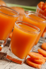 Fresh carrot juice in the glass, selective focus