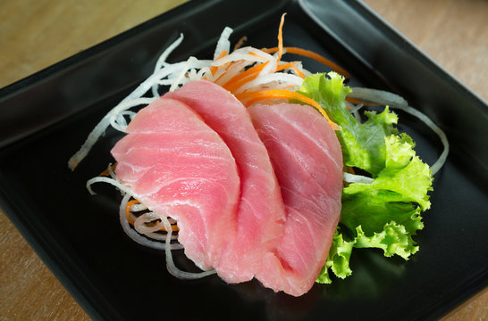 fresh sashimi saimon on wood background 
