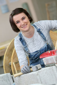 Young woman in masonry professional school