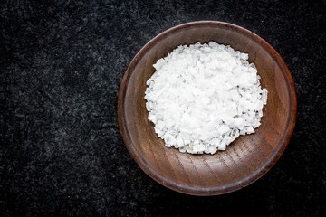 Fototapeta na wymiar sea salt in a wooden bowl