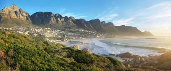 Camps Bay Beach in Cape Town, South Africa, with the Twelve Apostles in the background.