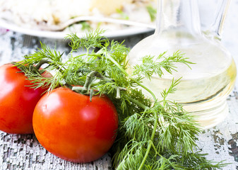 tomato, dill on the wooden table