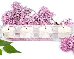 Obraz na płótnie Canvas Lilac Blossoms and Candles on white background. 