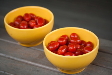 Cherry tomatoes in yellow bowl