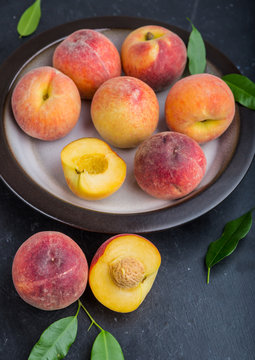 Ripe juicy peaches on a plate ready to eat