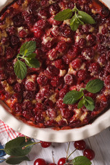 homemade cherry Clafoutis close up in a dish. vertical top view

