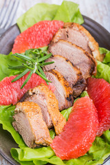 Roast duck breast with lettuce and grapefruit