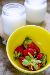fresh strawberries and fresh yoghurt in a glass