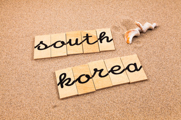 Words formed from small pieces of wood containing a sun and beach tourist destination, South Korea