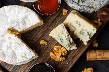 Cheese plate served with  jam and honey
