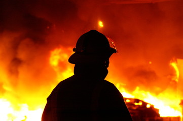 Fototapeta premium fire fighters at large factory fire