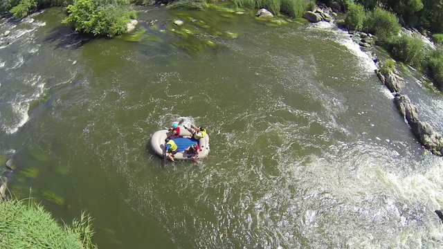 Boat with tourists on river. Aerial   top view of rafting team