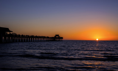 Fototapeta na wymiar Ocean Front Pier At Sunset