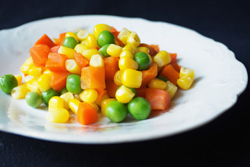 cooked vegetables on a white plate