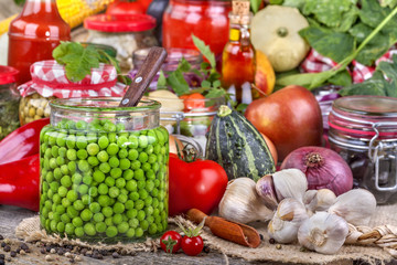 Canned peas with different fruits and vegetables in the background