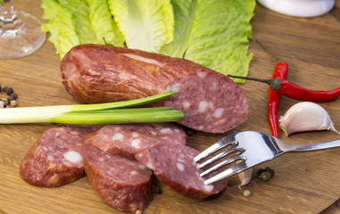 sausage on a wooden plate in a restaurant