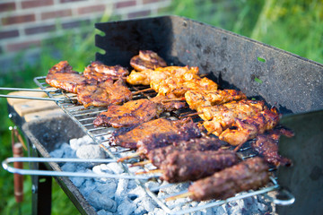 Grilling of various meat varieties in the garden