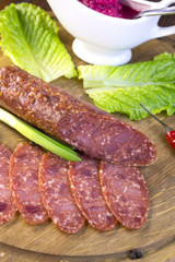 sausage on a wooden plate in a restaurant