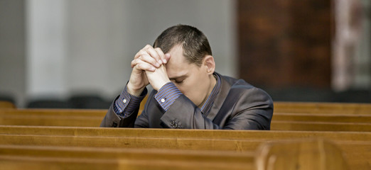 Man praying in church