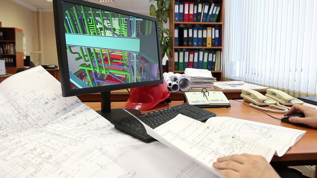 Architect with blueprints drafting 3d model of building at pc, human hands