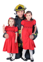  Fireman with his two young daughters isolated white