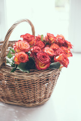 roses in a basket on the table