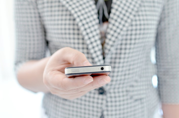 Young girl touching smart phone