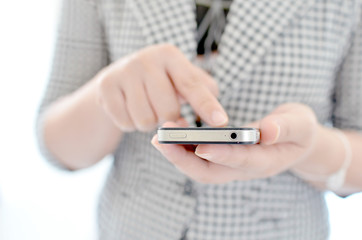 Young girl touching smart phone